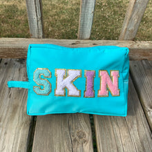 Load image into Gallery viewer, Aqua “Skin” Travel Bag
